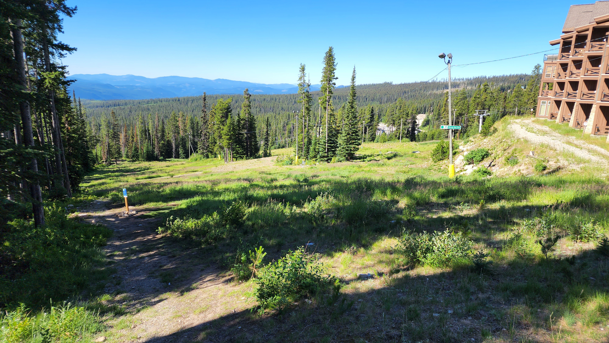 Mountain landscape with a disc golf basket silhouette