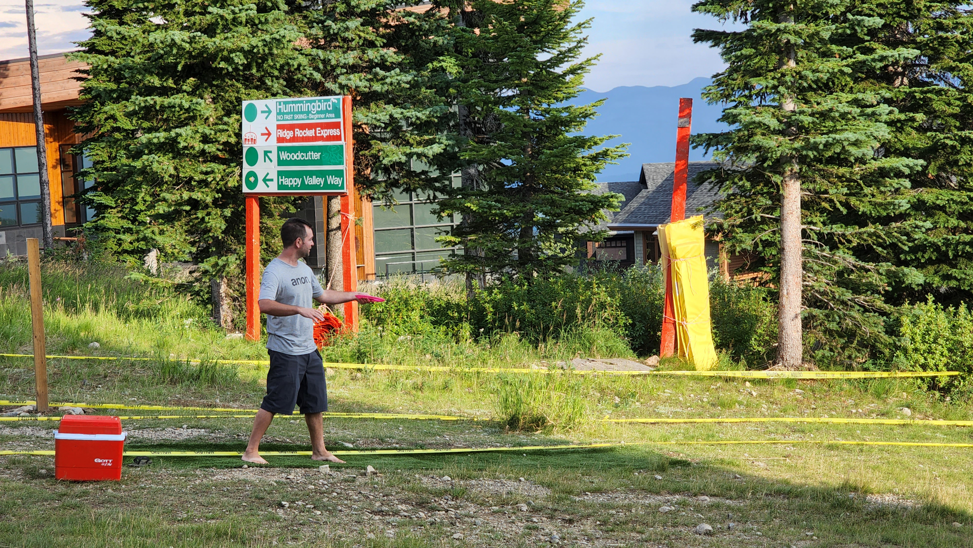 Mountain landscape with a disc golf basket silhouette