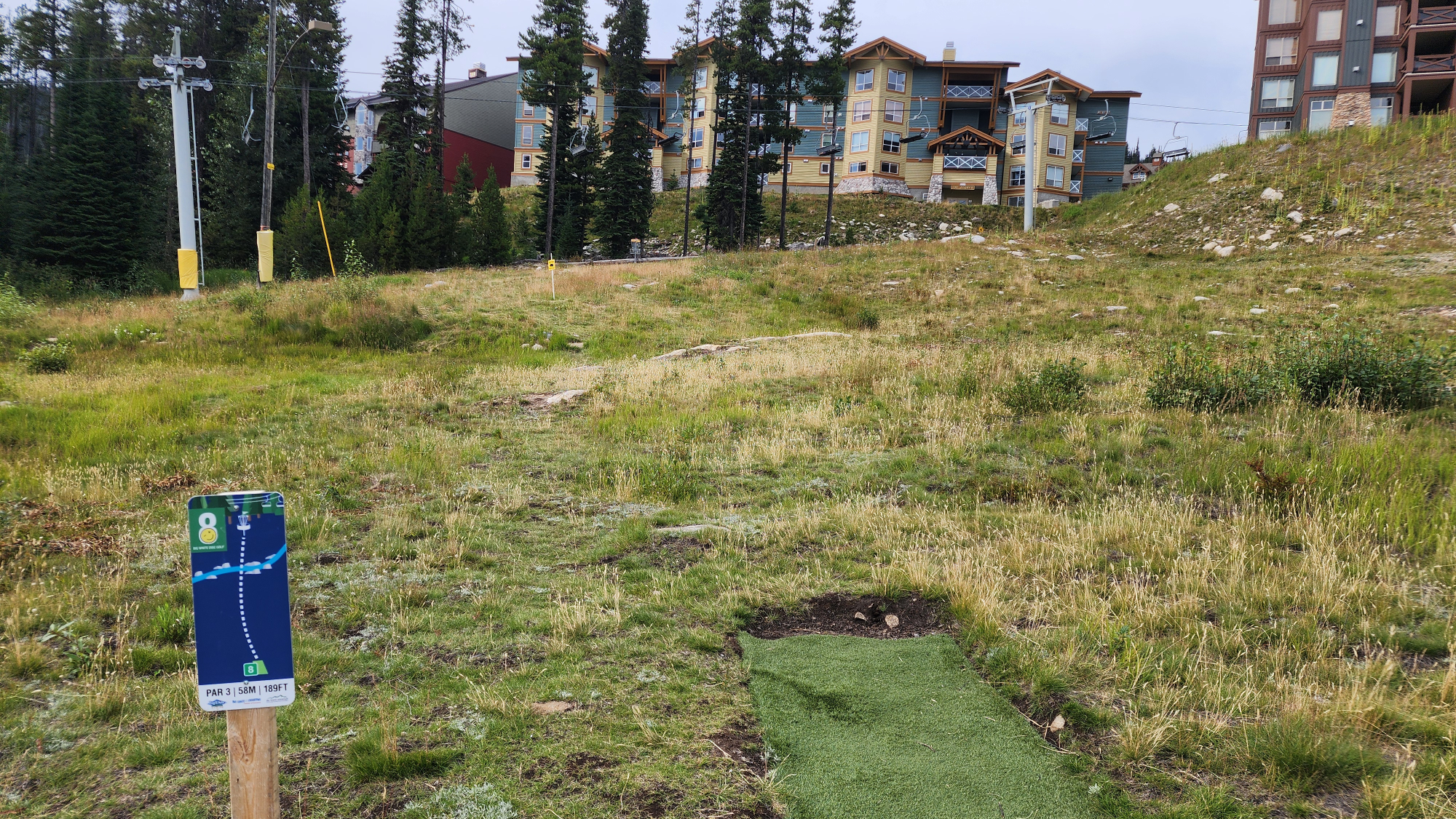 Mountain landscape with a disc golf basket silhouette